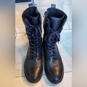 Black leather lace up combat boots with fur trim inside